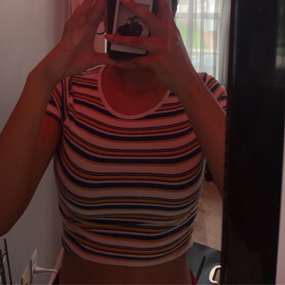 I’m selling this black,white,blue, and yellow crop top